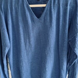 Women’s v-neck long sleeve sweater. Length from shoulder to hem is 24 inches.
